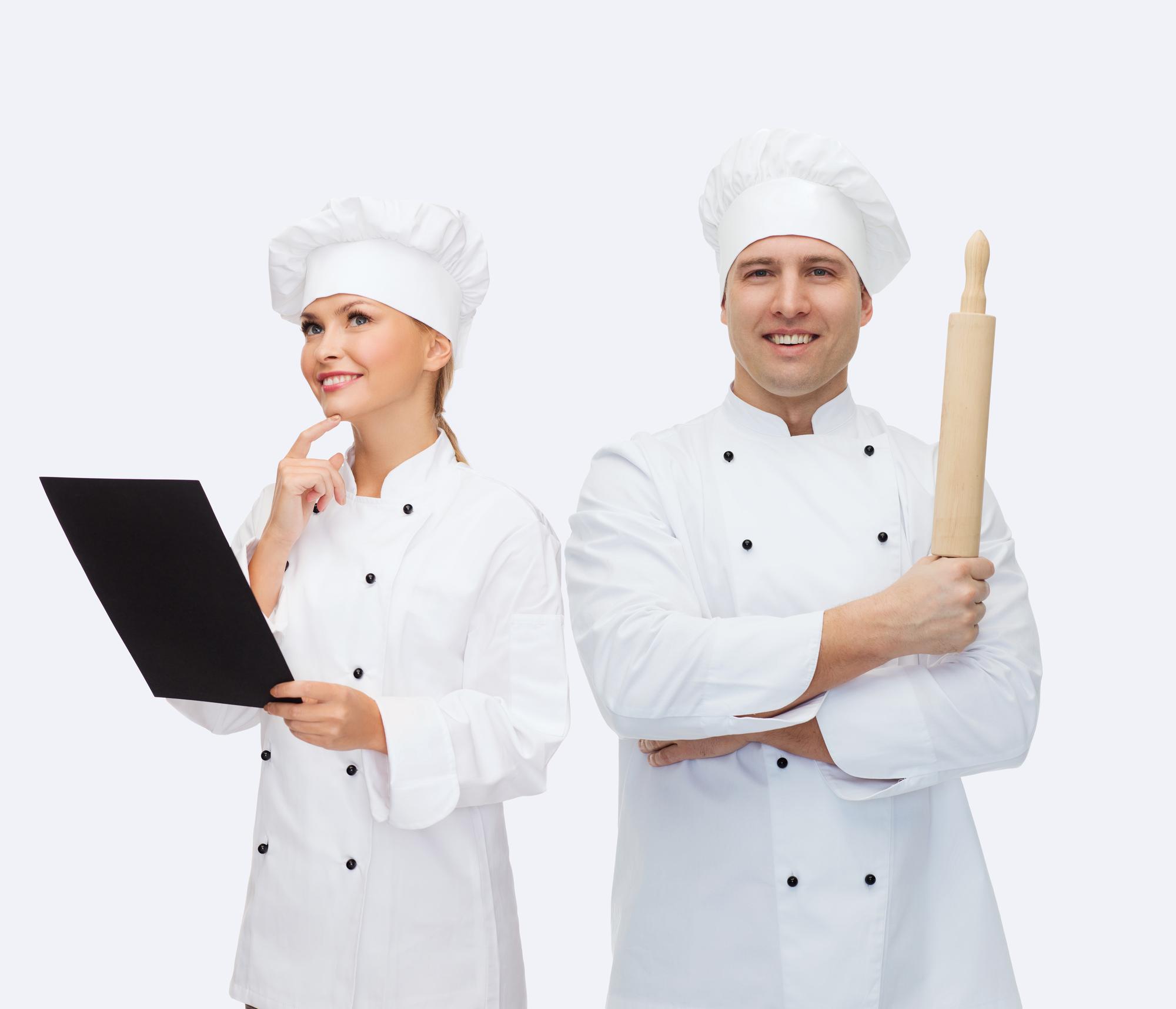 Chef coaching small team in kitchen